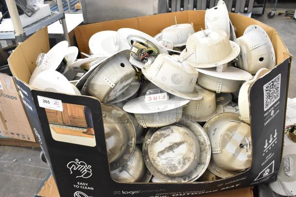 Pallet lot of Wheelock CBB-8 speaker enclosures, varied condition, labeled with "FIRE." Suitable for bulk purchase.