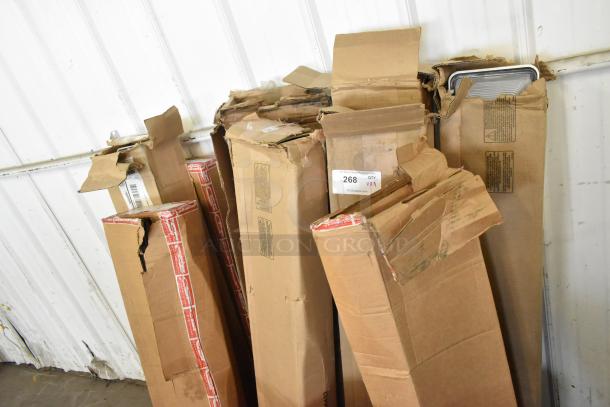 9 cardboard boxes including iSystems lights, showing signs of wear and shipping labels, lot number 268 VX4.