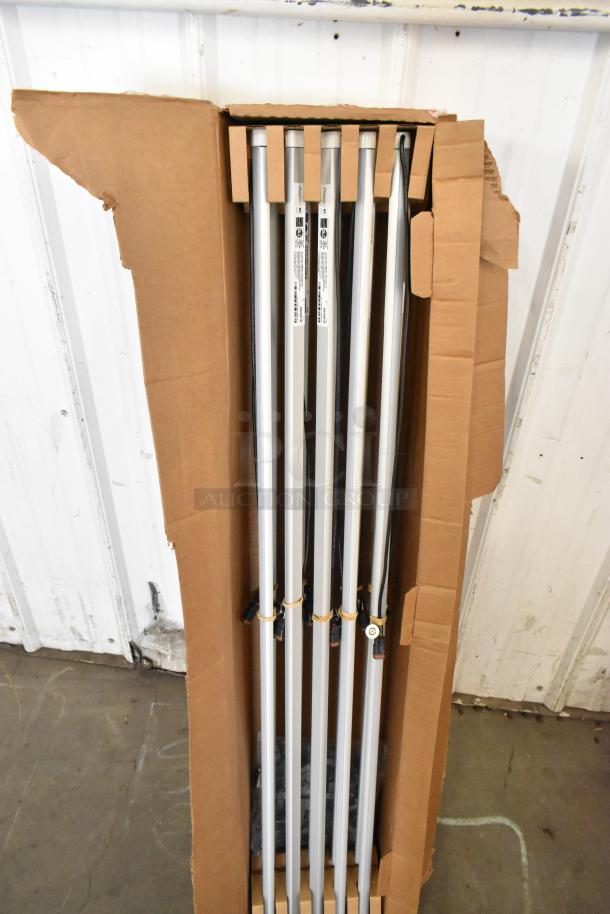 Cardboard box containing multiple iSystems lights, labels visible; likely part of a lot including nine various boxes.