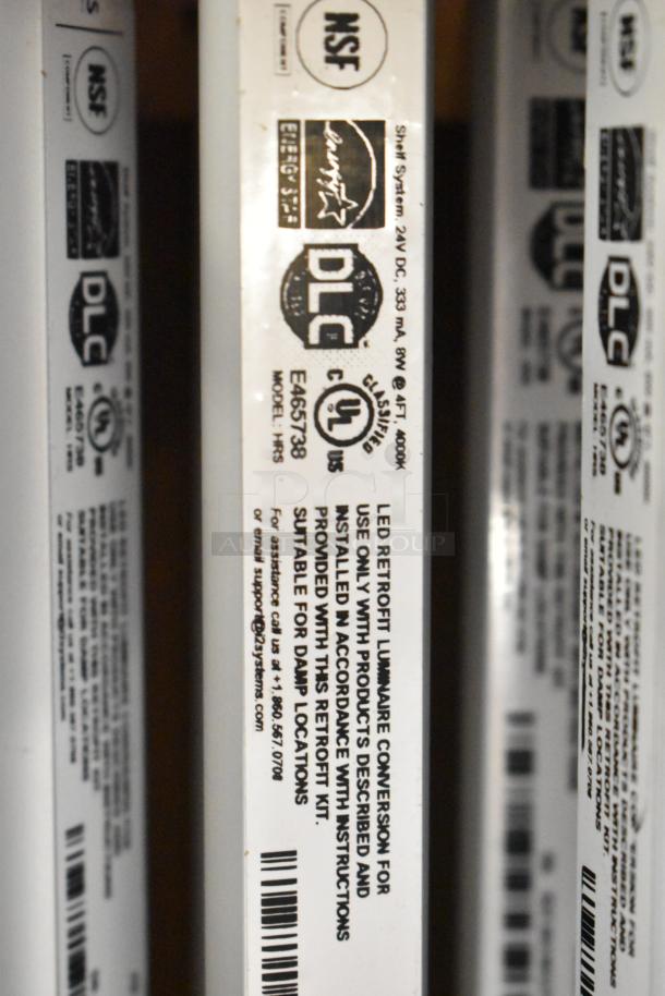 Nine iSystems light boxes with labels, including NSF, DLC, and UL markings. Model HRS, suitable for damp locations.