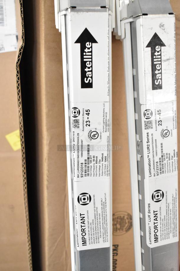 Boxes containing iSystems lights, Satellite series label visible, condition appears new. Lumination LUR2 series, 9 boxes.