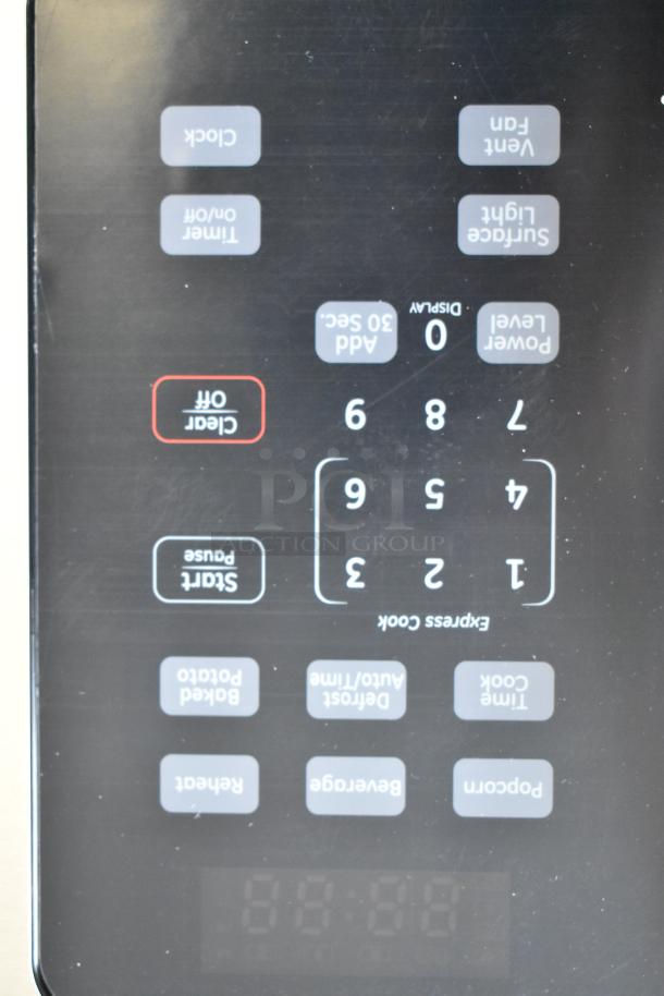 KoolMore KM-MOT-1SS stainless steel microwave oven control panel with digital display and various function buttons.
