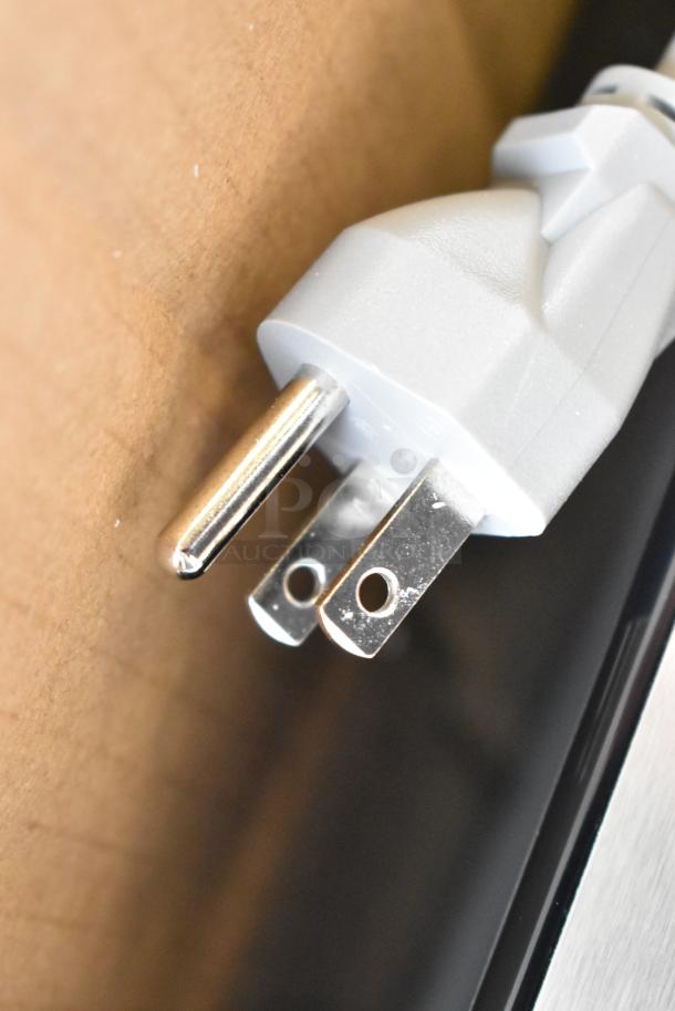 Close-up of the KoolMore KM-MOT-1SS microwave oven plug. Stainless steel model, brand new with minor scratches or dents.