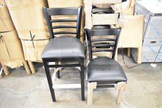 42 Lancaster Table & Seating stools: black wood, ladder back design, black vinyl seats, dining and bar height, scratch and dent condition.