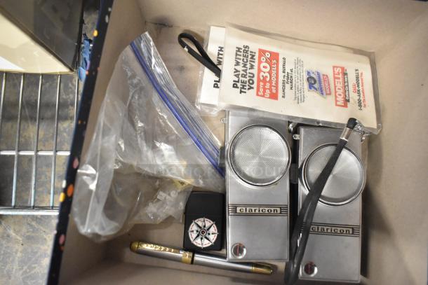 Vintage Claricon speaker pair, compass case, pen, and pamphlets in a box. Items appear used; no visible damage.