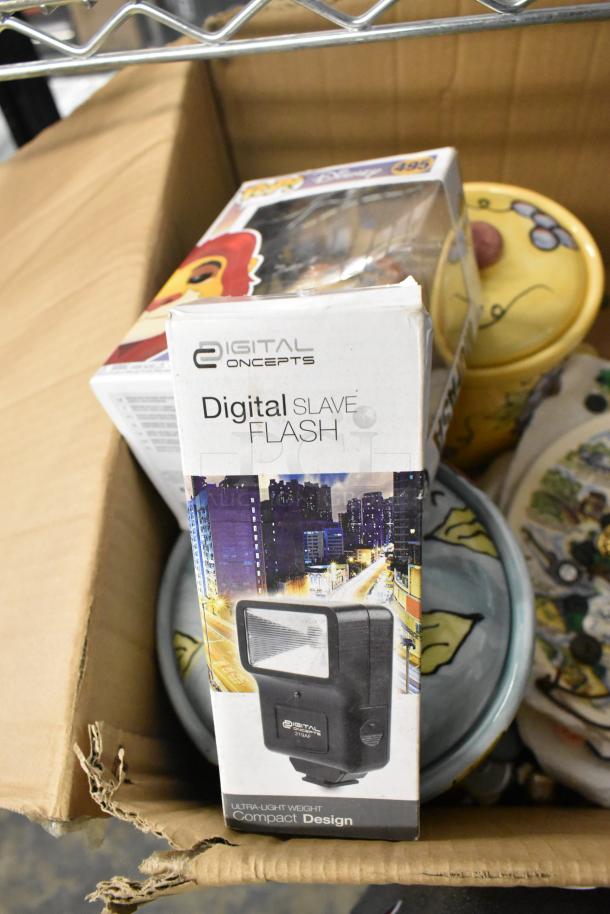 Auction lot includes Digital Concepts flash, ceramic containers, state plates, and a ring pool. Items in used condition.