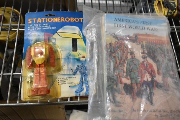 Tier lot featuring Stationerobot with pencil sharpener, pen, eraser, letter opener; book on America's First World War.