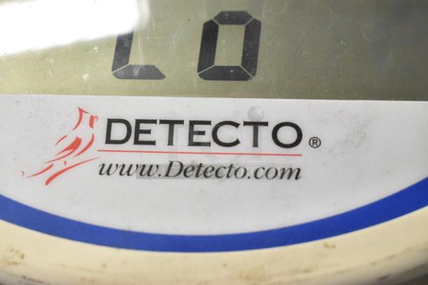 Detecto SCS30 hanging produce scale, digital display, minor wear on surface, website marked www.Detecto.com.