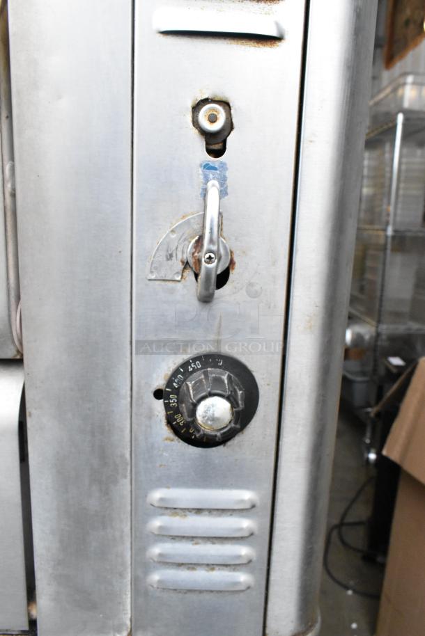 Blodgett stainless steel gas-powered 2-deck pizza oven, showing temperature dial and latch, in used condition.