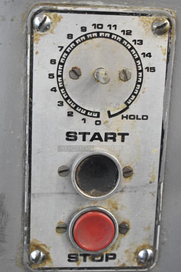 Control panel of Hobart L 800 dough mixer with start and stop buttons, numbered dial, slightly worn condition.