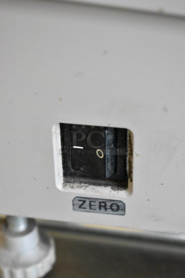 Bizerba BS 100 Metal Countertop Food Portioning Scale, showing a power switch with label "ZERO," indicating functionality.