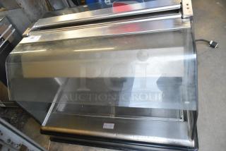 Henny Penny HI-3 stainless steel heated display case, model HI-3, 120/208V, 1 phase, glass front, commercial condition.