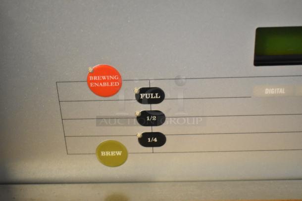 Bunn DUAL SH DBC coffee machine control panel, showing brewing options and digital display.