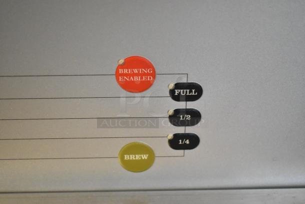 Bunn DUAL SH DBC coffee machine control panel showing brewing settings, including "Brewing Enabled" and brew size options.