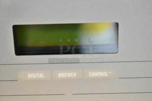 Bunn DUAL SH DBC coffee machine display panel with digital brewer control labels shown.