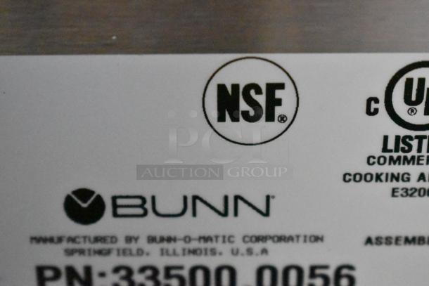 NSF logo and Bunn branding on the label of a 2024 Bunn DUAL SH DBC stainless steel commercial coffee machine.
