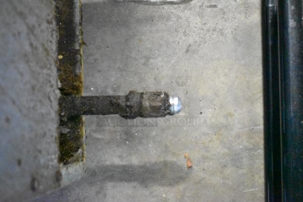 Close-up image of a gas line connection, part of the Dean SR152GN Commercial Gas Deep Fat Fryer setup.