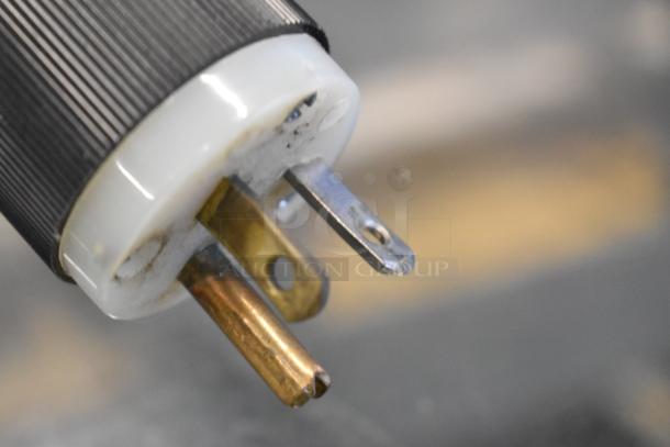 Close-up of a plug for the Federal Industries VH-77 metal floor style display case merchandiser, 118 volts, 1 phase.