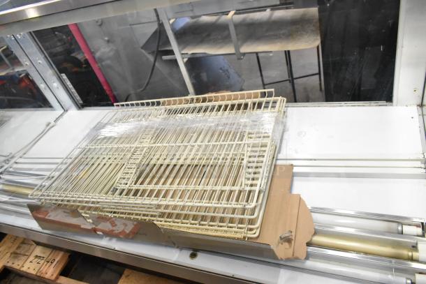 Federal Industries VH-77 Metal Floor Display Case, 118 Volts, 1 Phase, with visible wire shelves in used condition.