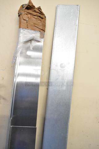 Two metal panels, one wrapped in paper and plastic. Both appear new with a smooth, reflective surface.