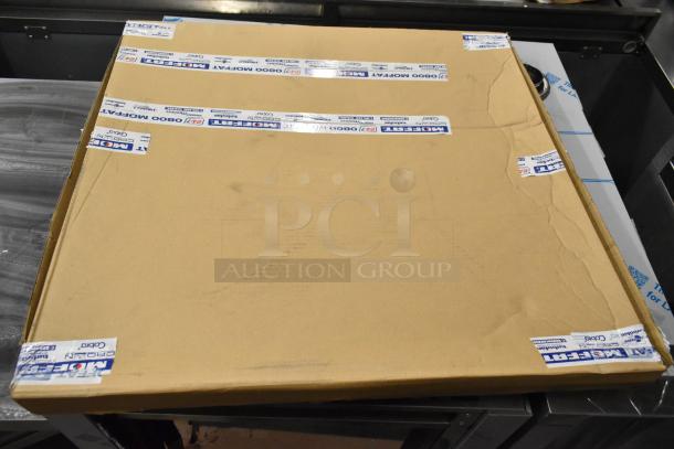 Cardboard box with Moffat branding, containing a scratch-and-dent 2024 Moffat E35D6-26-P263 convection oven with broken glass door.