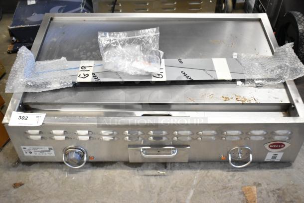 Brand new Wells G19 stainless steel commercial griddle, 36" electric, 208V, scratch and dent condition, labeled "G19".