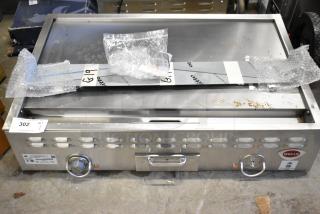 Brand new Wells G19 stainless steel commercial griddle, 36" electric, 208V, scratch and dent condition, labeled "G19".