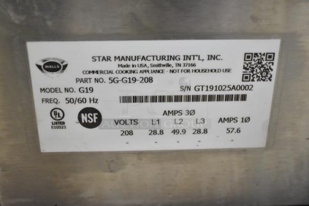 Wells G19 Griddle label showing model, voltage, and amps; commercial use only, NSF and UL listed, made in USA.