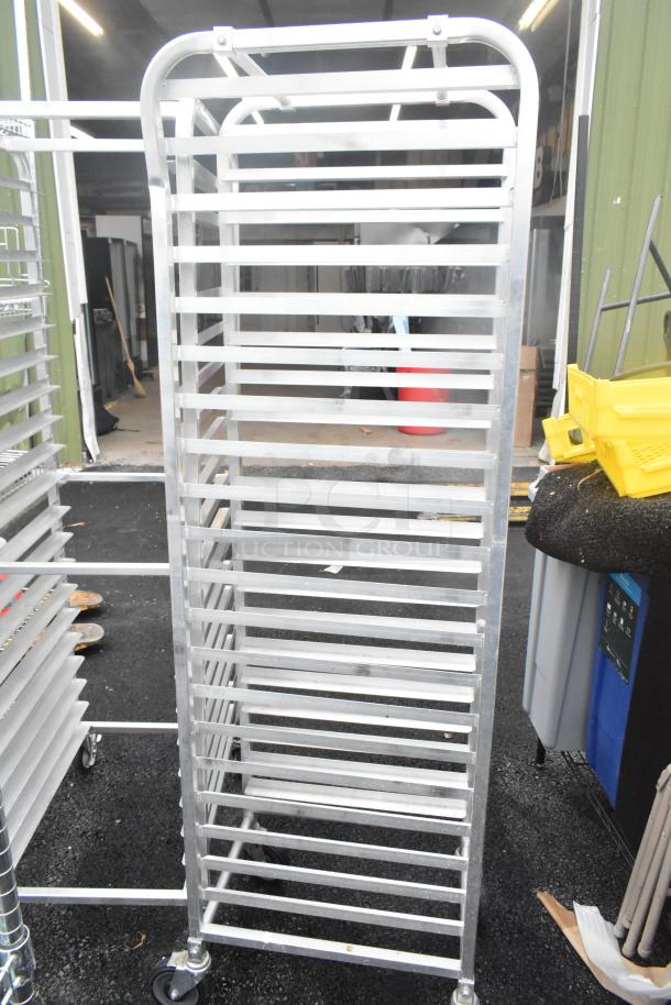 2 metal pan transport racks on commercial casters, ideal for kitchens, excellent condition, auction includes double bid value.