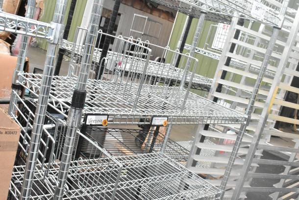 Chrome finish 4-tier wire shelving unit, excellent condition, with labeled sections, buyer must dismantle for shipping.