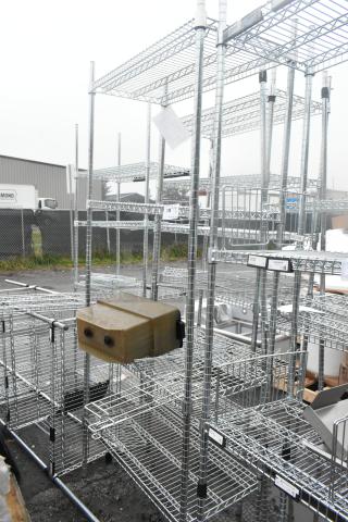 Chrome finish 4-tier wire shelving unit in good condition. Buyer must dismantle. Consider freight charges.