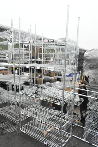 Chrome finish 5 tier wire shelving unit. Sturdy metal construction, visible labels. Buyer must dismantle. Consider freight.