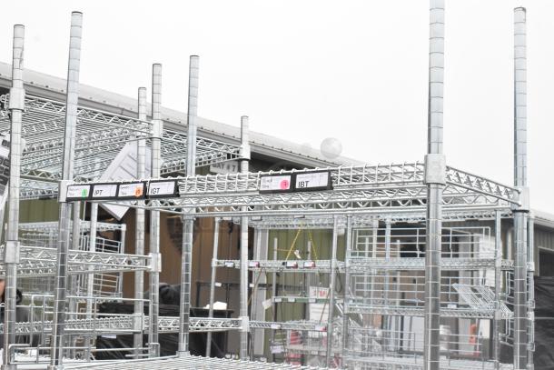 Chrome finish 5-tier wire shelving unit, excellent condition, visible labels, buyer must dismantle, freight charges apply.