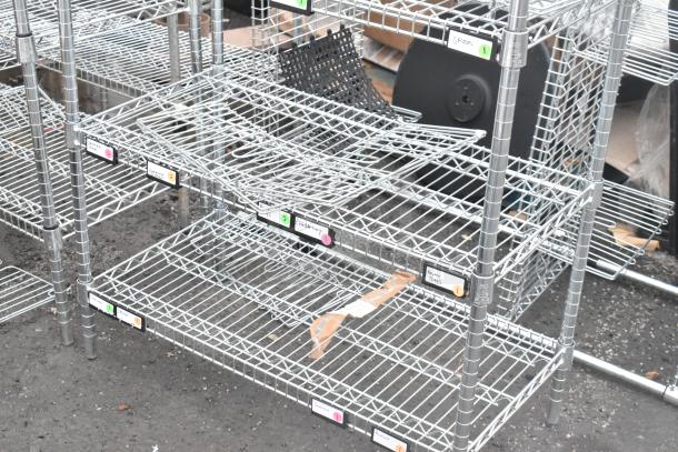 Chrome finish 5-tier wire shelving unit. Features sturdy construction, multiple storage labels. Buyer must dismantle.