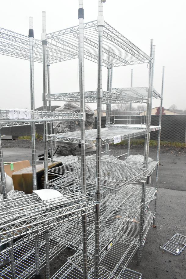 Chrome finish 6-tier wire shelving unit, excellent condition, with labels indicating shelf numbers. Buyer must dismantle.