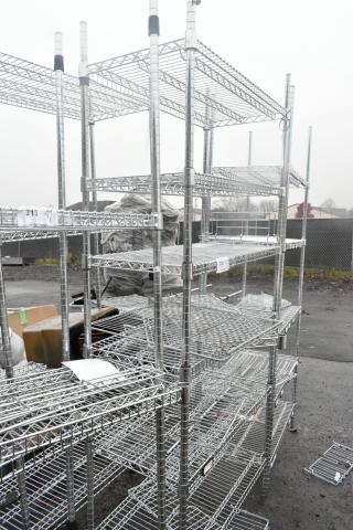Chrome finish 6-tier wire shelving unit, excellent condition, with labels indicating shelf numbers. Buyer must dismantle.