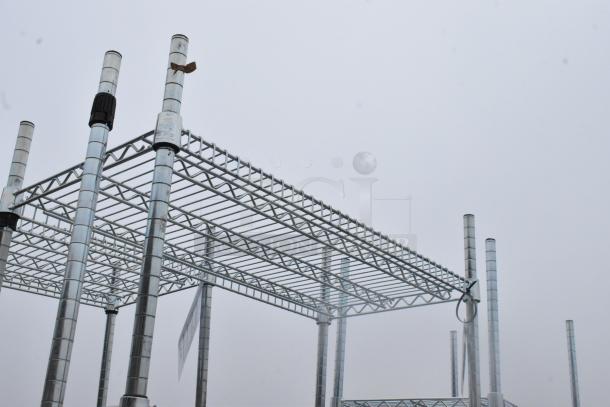 Chrome finish 6-tier wire shelving unit with adjustable poles. Buyers must dismantle for shipping.