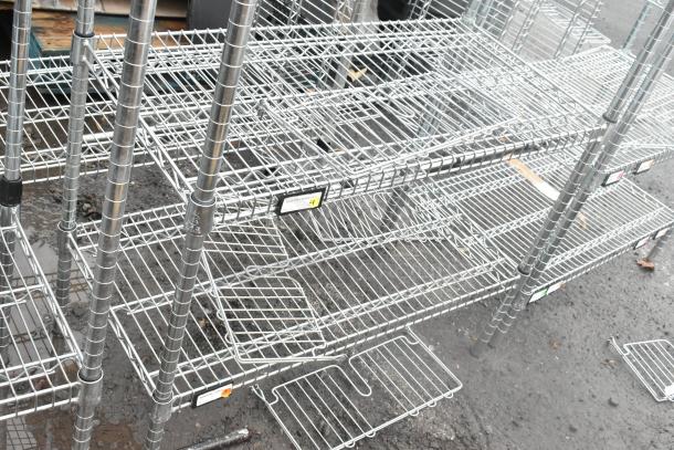 Chrome finish 6 tier wire shelving unit, showing multiple adjustable shelves and sturdy construction. Buyer must dismantle.