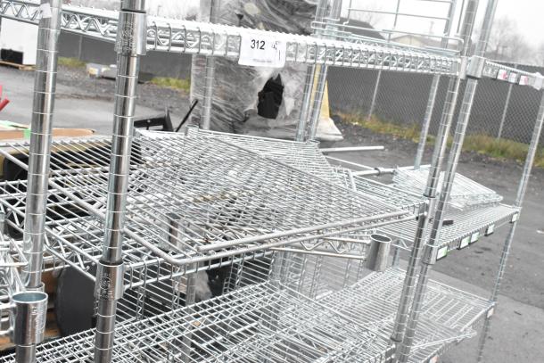 Chrome finish 6 tier wire shelving unit in used condition, featuring sturdy metal construction. Buyer dismantle required.