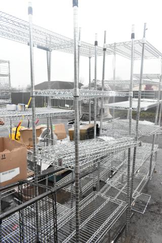 Chrome finish 4-tier wire shelving unit, needs dismantling, good condition, ideal for storage, freight charges apply.