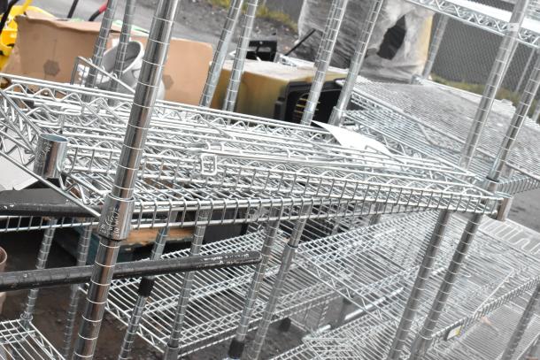 Chrome finish 4-tier wire shelving unit in good condition. Buyer must dismantle for shipping. Consider freight charges.