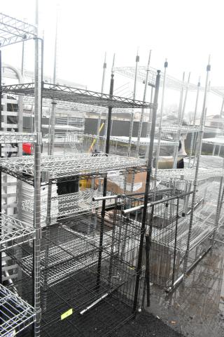 Two black finish wire shelving units, sturdy metal construction, buyer dismantles, suitable for heavy-duty storage.