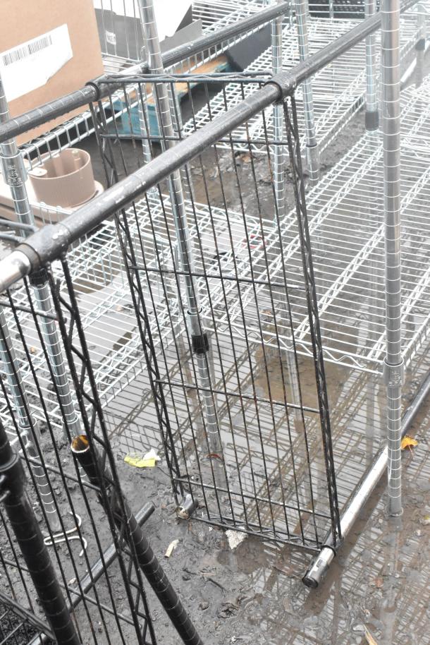 Two black finish wire shelving units, partially assembled, in used condition. Buyer must dismantle. Consider freight charges.