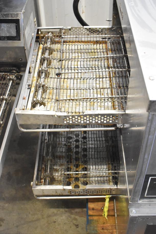 Two 2021 Middleby Marshall CTX DZ33I stainless steel conveyor pizza ovens on casters. Visible wear, 208V, 3/1 phase.