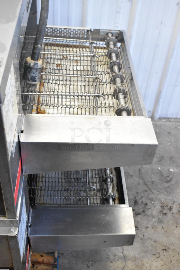 2 Middleby Marshall CTX DZ33I stainless steel conveyor pizza ovens on casters, 2021 model, 208V, 3/1 phase.