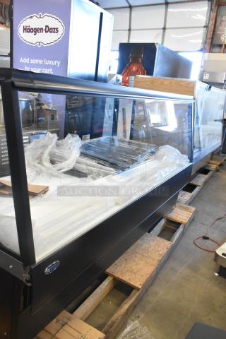 Federal metal floor-style merchandiser display case, features clear glass front, good condition, Häagen-Dazs branding visible.