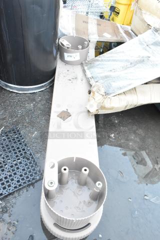 Two poly units with circular fittings, used condition, placed on a wet surface with packaging materials. Label marked "218" visible.