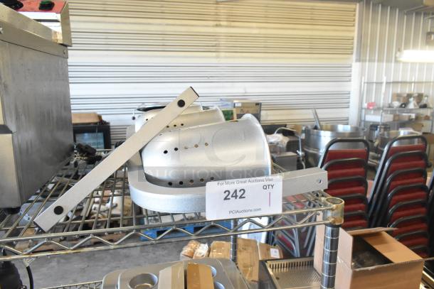 BRAND NEW Avantco 177W63 Heat Lamp with 3 bulbs, T-legs; scratch and dent condition; auction tag "242" visible.