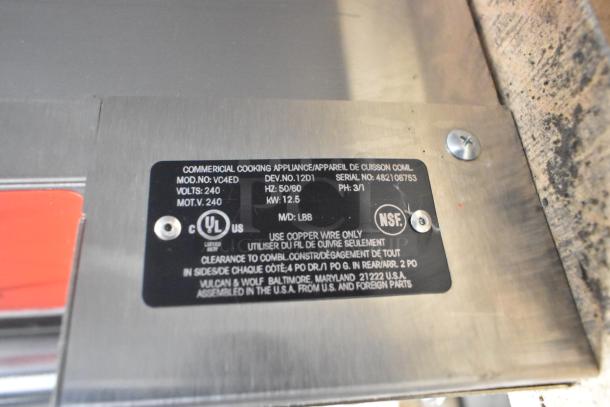 Label on Vulcan VC4ED stainless steel convection oven, detailing model, voltage, phase, and certification marks.