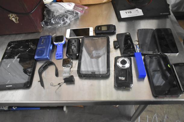 22 assorted electronic devices, including phones and a tablet, displayed in a basket. Various brands, conditions vary.